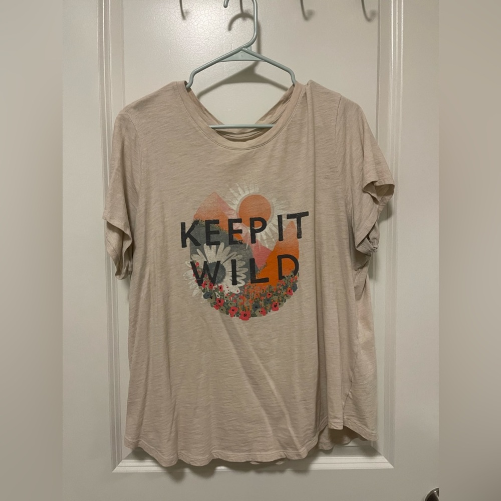 Tan shirt from Old Navy that says “keep it wild”